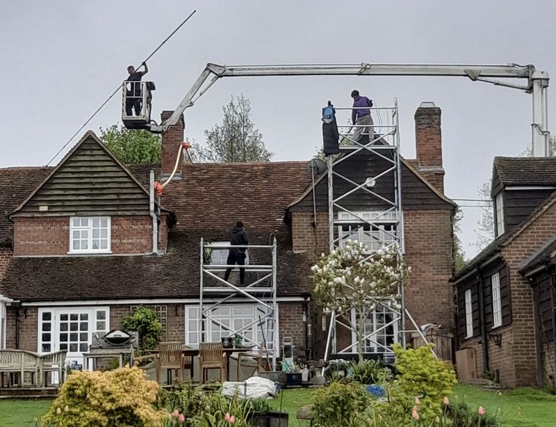 The Moss Cleaners using cherry picker and scaffolding to clean roof safely and professionally in Bidford-on-Avon, Warwickshire